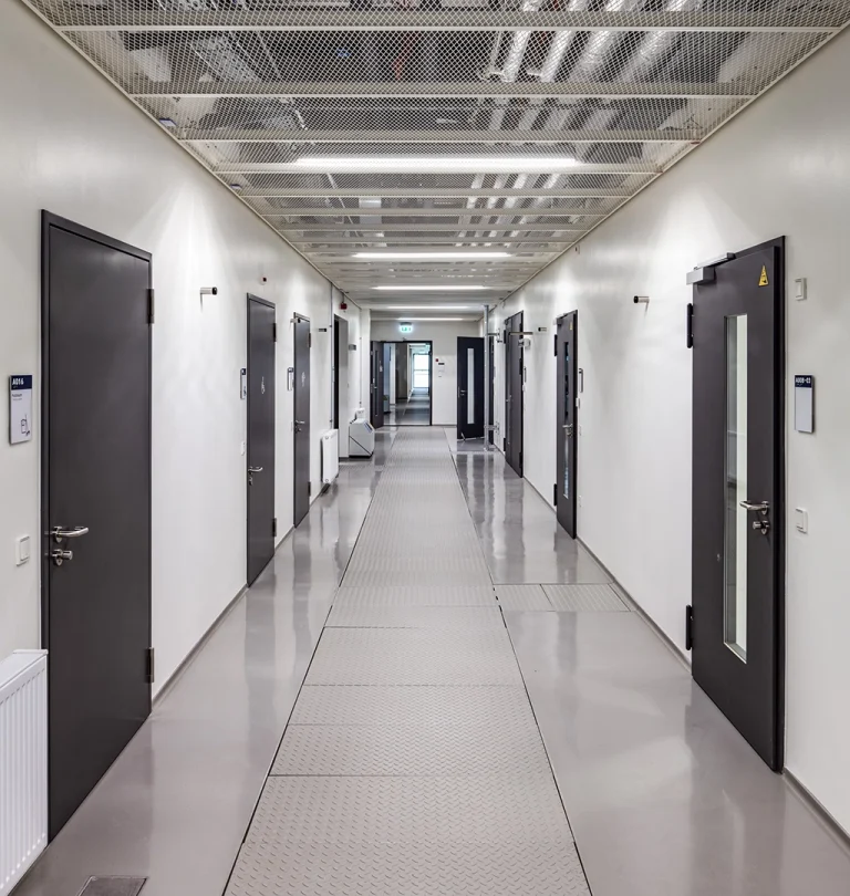 Long hospital corridor with BUCHELE security doors with vision panels