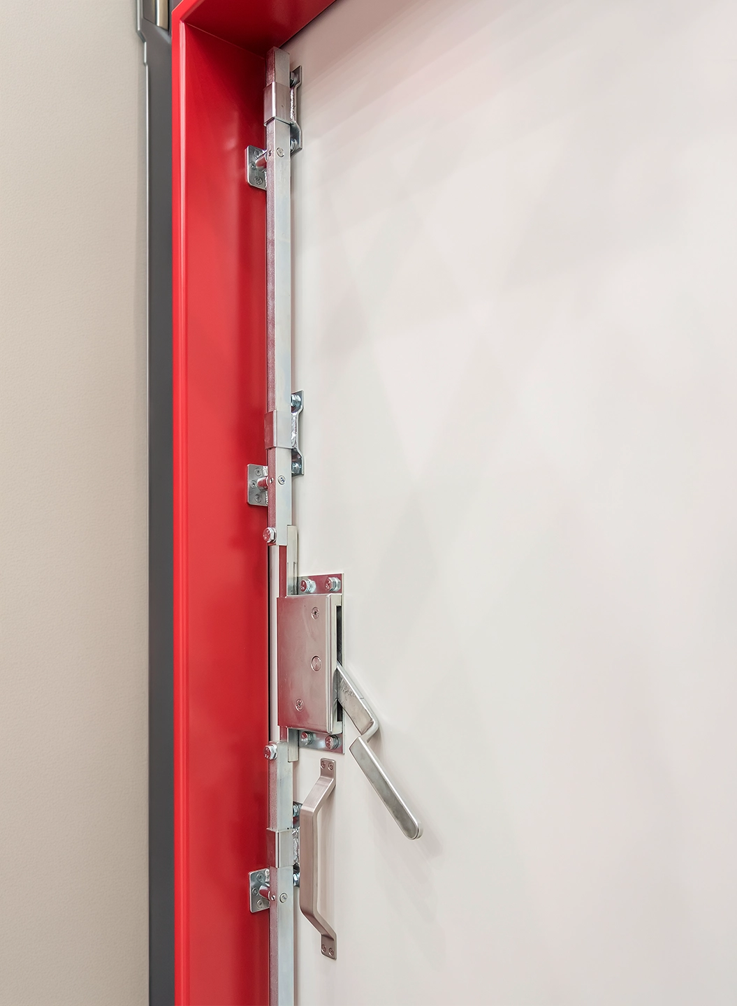 Flood protection door by BUCHELE with red frame and locking levers